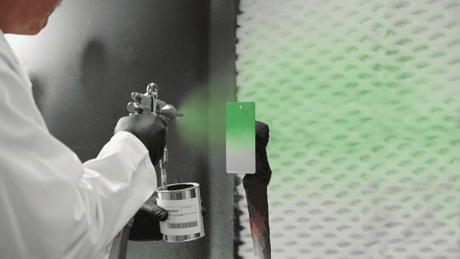 using a spray gun to test the quality of the industrial coating
