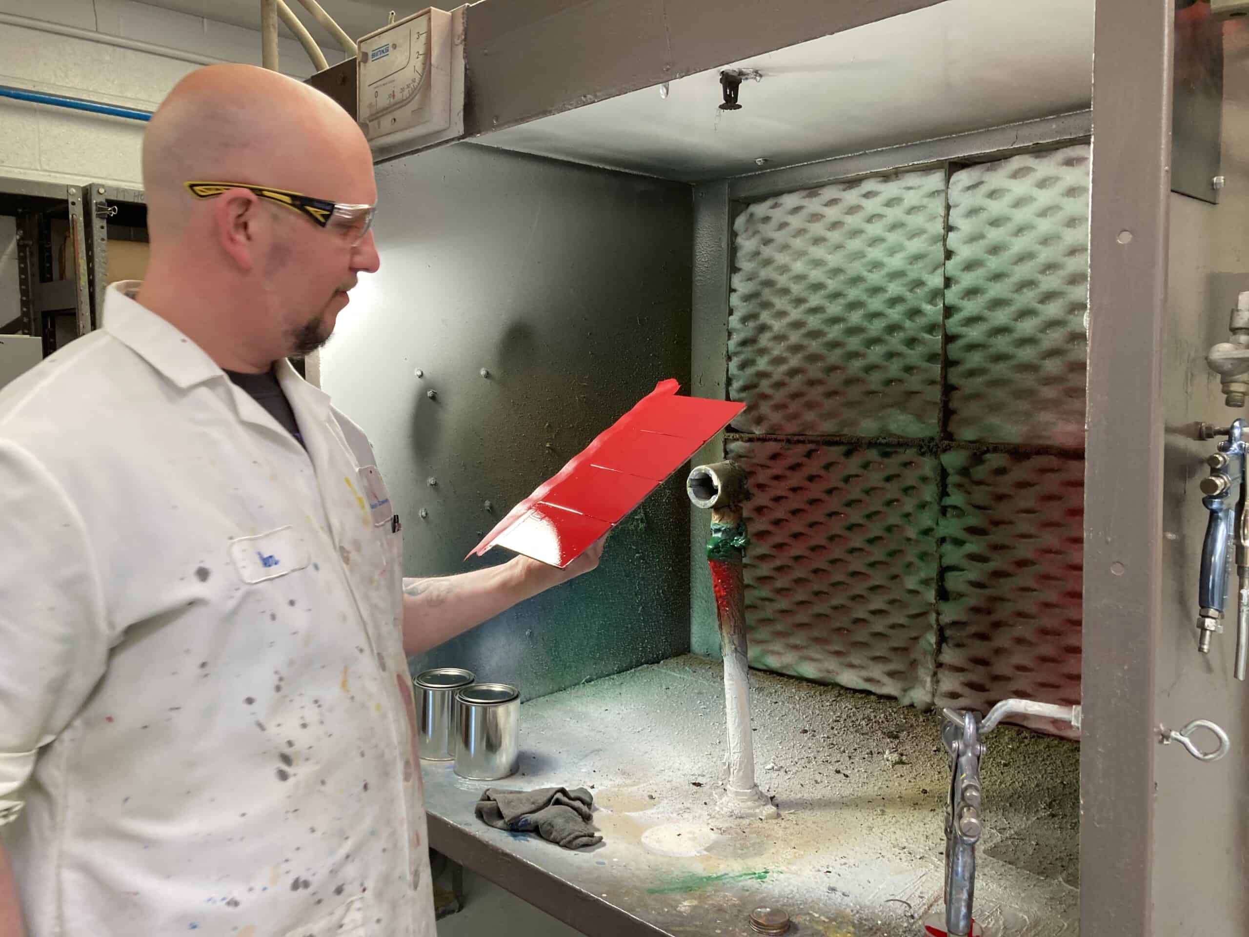 Industrial Coating Specialist Testing a red paint